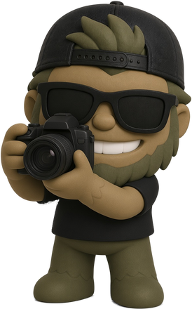 Mountain Dude mascot holding a camera